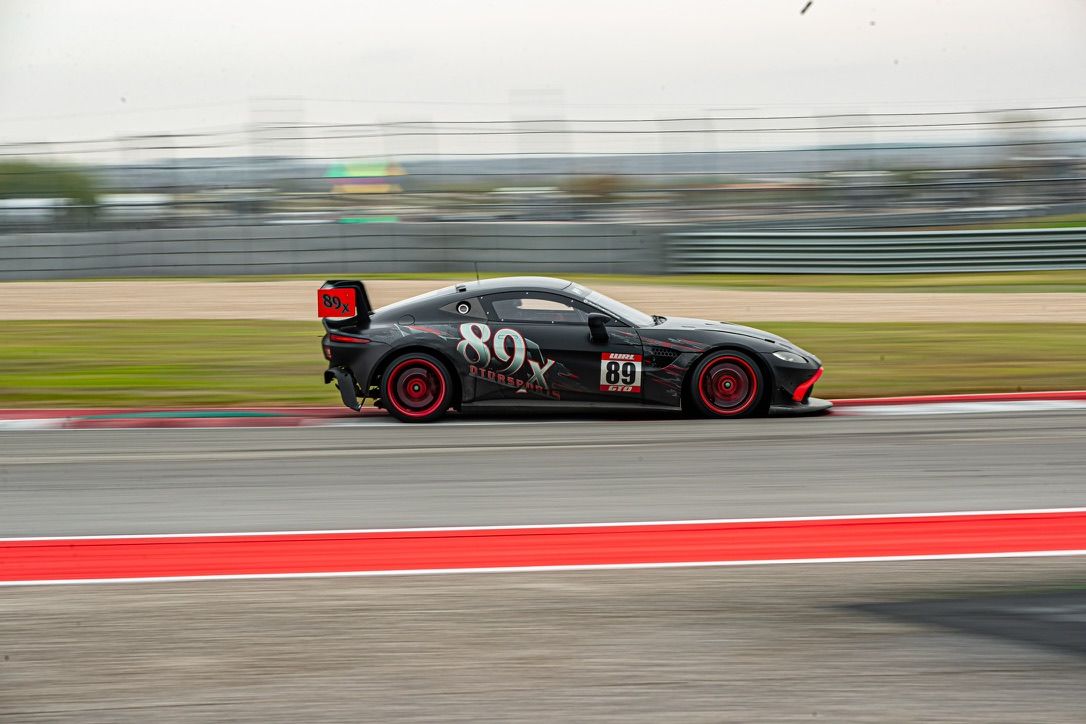 The 89x Aston Martin GT4 at speed at COTA